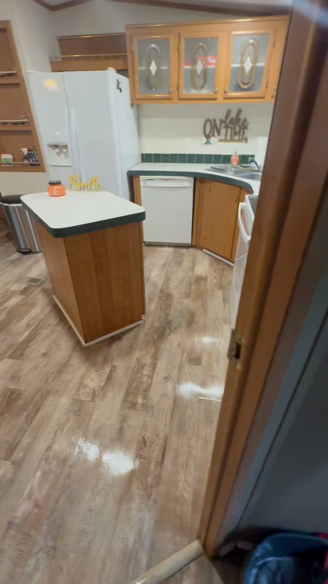 A lake-house kitchen and shiny floors after a Truly Beyond Clean rental turnover